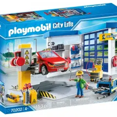 Zestaw Playmobil warsztat samochodowy z czerwonym autem na podnośniku, mechanikiem i narzędziami.